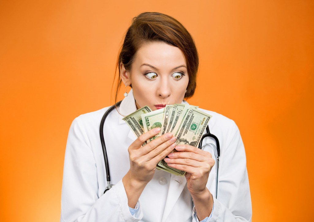 doctors holding cash
