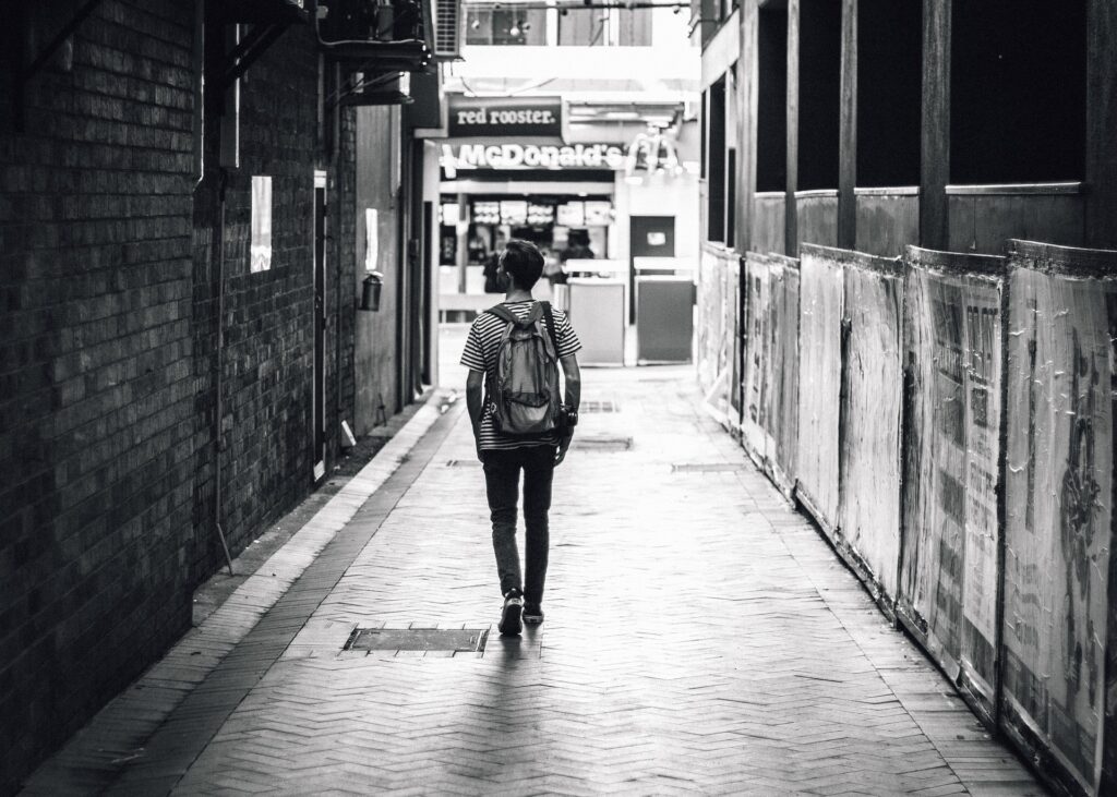 ordinary person walking down the sidewalk