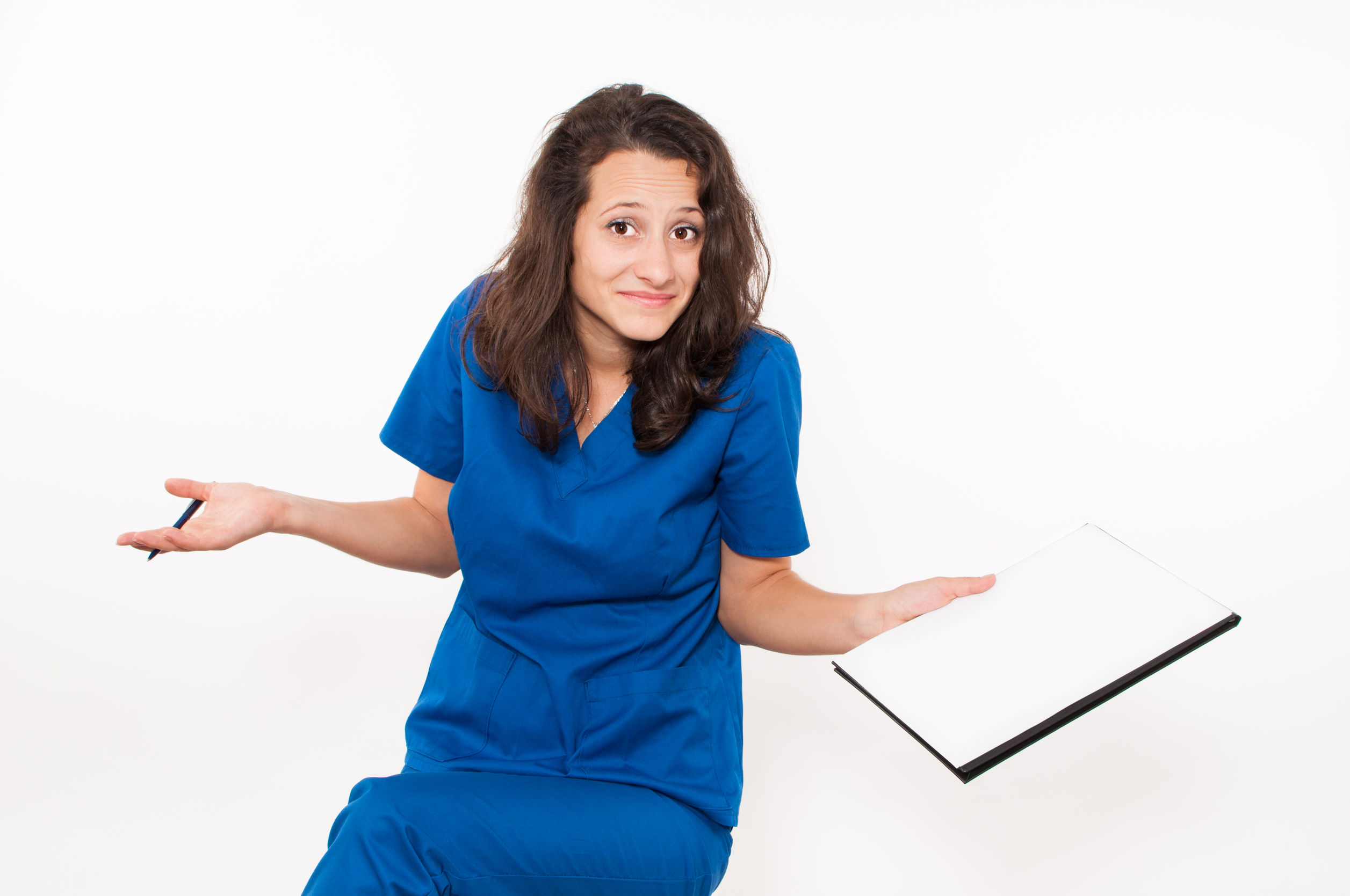 A confused female doctor holding a clipboard as an example of what doctors wish their patients knew